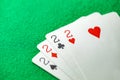 Playing cards, poker combination four of kind, quads, deuces of different suits, same value Royalty Free Stock Photo