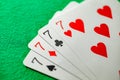 Playing cards, poker combination four of kind, quads, sevens of different suits, same value Royalty Free Stock Photo
