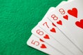 Playing cards, poker combination straight flush red suit of hearts from five to nine Royalty Free Stock Photo