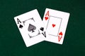 Playing cards for poker on a green table. Gambling. Two aces Royalty Free Stock Photo
