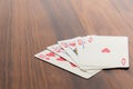 Playing cards - poker hand royal flush hearts Royalty Free Stock Photo