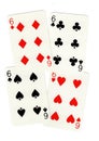 Playing cards showing four sixes.