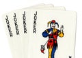 Playing cards showing a hand of four jokers.