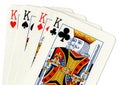 Playing cards showing a hand of four kings.
