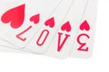 Playing cards spelling the word love on white Royalty Free Stock Photo
