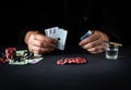 Playing cards with a winning combination of three of a kind or set in a player hand in a poker club. Luck or success in the Royalty Free Stock Photo