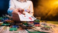 Playing in a casino, online casino. A player opens cards with two aces. Money, poker table, chips. Background for the gaming Royalty Free Stock Photo