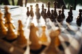 Playing chess on a chessboard at sunset. Tactics and strategy. Black and white figures. Royalty Free Stock Photo