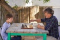 Playing chess with his granddad. a young boy playing chess with his grandfather. Royalty Free Stock Photo