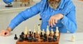 Playing chess. Intellectual hobby. Figures on wooden chess board. Learning play chess. Chess lesson. Strategy concept