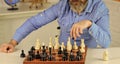 Playing chess. Intellectual hobby. Figures on wooden chess board. Learning play chess. Chess lesson. Strategy concept