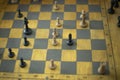 Playing chess in tournament. Chess pieces on board. Sports competition at school. Gaming prowess