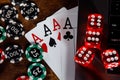 Playing chips, red dices, cards with aces and laptop close-up. Top view. Poker theme Royalty Free Stock Photo