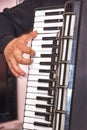 Playing at chromatic accordion at a party