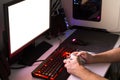 Playing computer game with gaming gear. Royalty Free Stock Photo