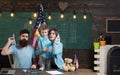 Playing concept. Family playing with paper planes in school. Little boy and teachers playing pilots in class. Playing Royalty Free Stock Photo