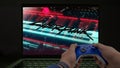 Playing Cyberpunk 2077 on a computer with a blue xbox controller