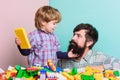 Playing with daddy. building home with constructor. child development. happy family leisure. father and son play game Royalty Free Stock Photo