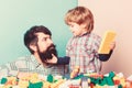Playing with daddy. building home with constructor. child development. happy family leisure. father and son play game Royalty Free Stock Photo