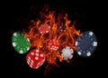 Playing dices and casino chips on fire. poker concept