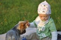 Child playing with a dog