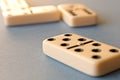 Playing dominoes on a blue background . Domino concept Royalty Free Stock Photo