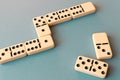 Playing dominoes on a blue background . Domino concept Royalty Free Stock Photo