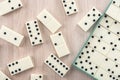 Playing dominoes on a wooden table Royalty Free Stock Photo