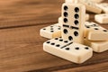 Playing dominoes on a wooden table. Domino effect Royalty Free Stock Photo