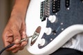 Playing electric guitar close up view. Plug in. Royalty Free Stock Photo