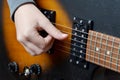 Playing the electrical guitar. Closeup view of playing electric guitar