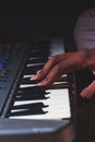 Playing the Electronic Keyboard in Music Recording studio close up on hands. Playing electronic Piano