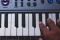 Playing Electronic Keyboard from top view composition in Music Recording studio close up on hands. Playing electronic Piano