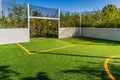 Playing field for small garden with artificial lawn, synthetic turf playing field, artificial grass pitch Royalty Free Stock Photo