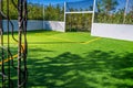 Playing field for small garden with artificial lawn, synthetic turf playing field, artificial grass pitch Royalty Free Stock Photo