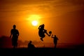 Playing footbal at the sunset on the beach Royalty Free Stock Photo