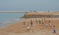 Playing football on the beach Royalty Free Stock Photo