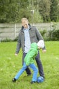 Playing football together with son Royalty Free Stock Photo