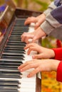 Playing the four hands piano, side view