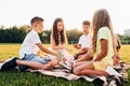 Playing games. Group of happy kids is outdoors on the sportive field at daytime Royalty Free Stock Photo