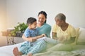 Playing, gay family and morning in bed or home bedroom for security, quality time and love. Adoption, lesbian or LGBTQ Royalty Free Stock Photo