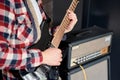 Playing guitar and concert concept. Repetition of rock music band. Man of electric guitar player. Rehearsal base Royalty Free Stock Photo