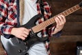 Playing guitar and concert concept. Repetition of rock music band. Man of electric guitar player. Rehearsal base Royalty Free Stock Photo