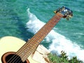 Playing guitar looking the sea Royalty Free Stock Photo