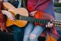 Playing guitar and meeting on roof, close up Royalty Free Stock Photo