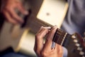Playing guitar, music and hands of a man on an instrument, learning and strumming for entertainment. Jazz, talent and Royalty Free Stock Photo