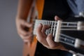 Playing the guitar. Teenager playing guitar. Close up. Lifestyle concept