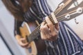 Playing guitar. woman playing chords on guitar Royalty Free Stock Photo