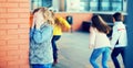 Playing hide and seek. Girl covering eyes her hands standing at Royalty Free Stock Photo