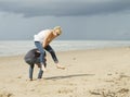 Playing leapfrog on the beach Royalty Free Stock Photo